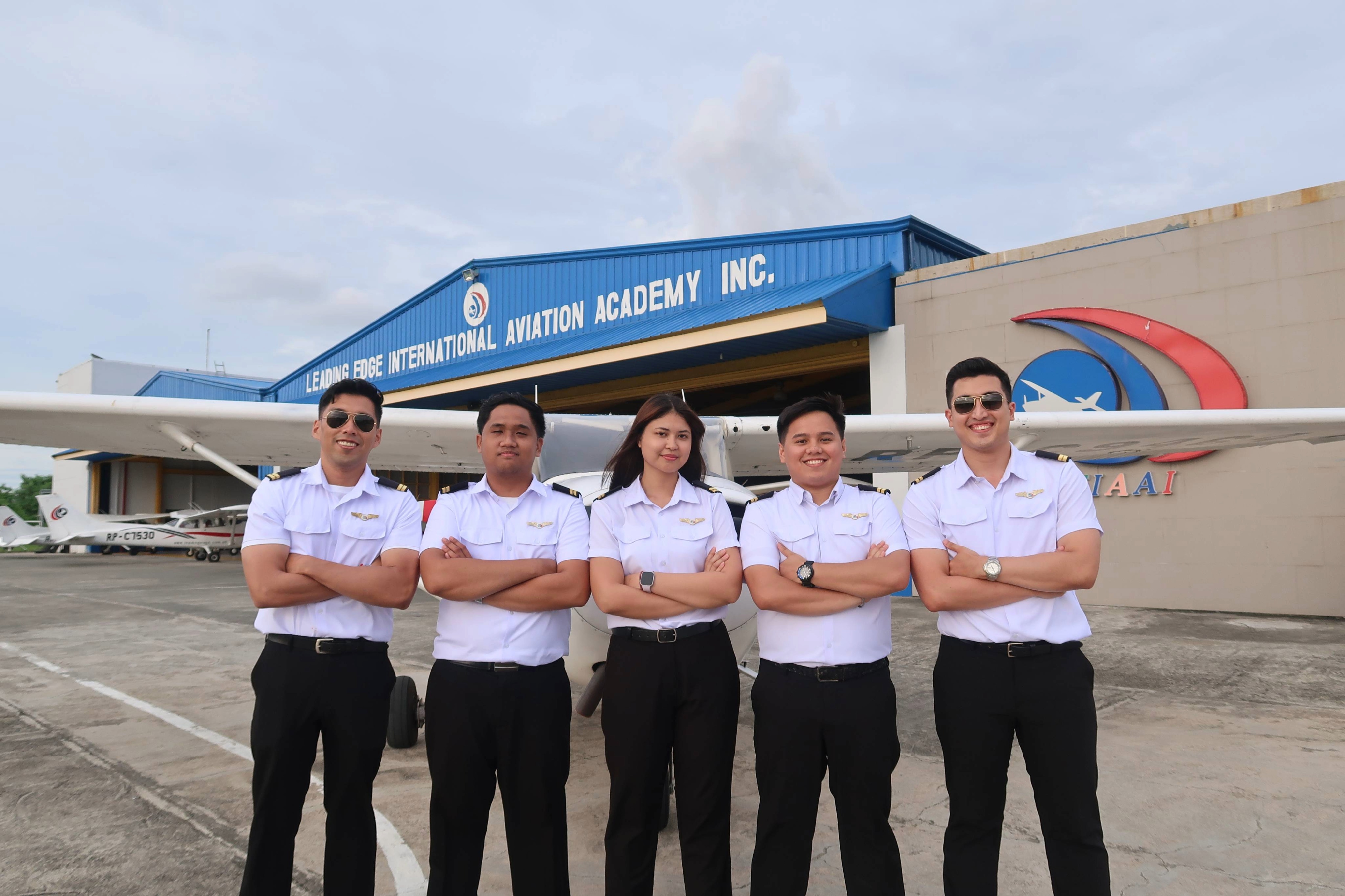 LEIAAI student pilots in uniform lined up beside the training fleet